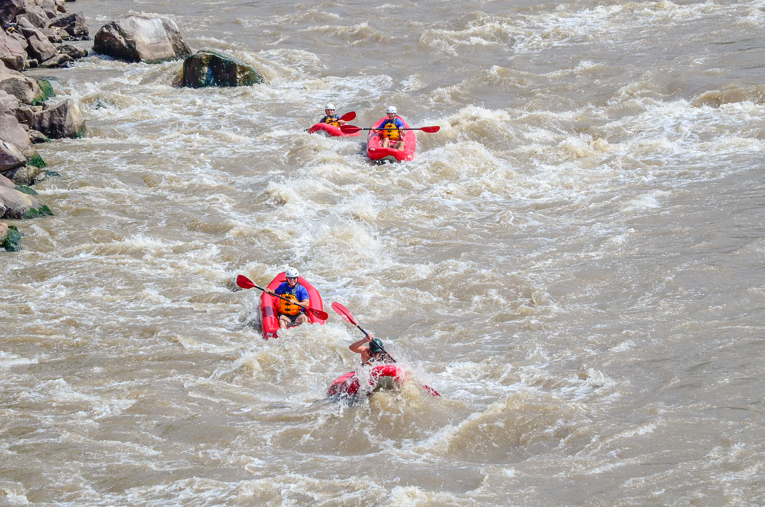 kayakers going down the rapids